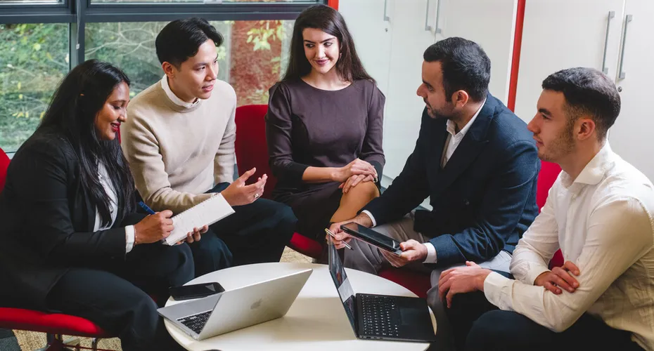Students on Exeter's world-leading One Planet MBA programme having a discussion together.