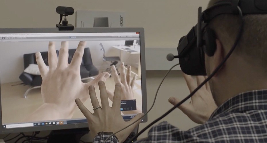 Using virtual reality, Caitlin allows a participant to embody abnormally large hands.