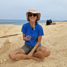 A female student sat on the beach