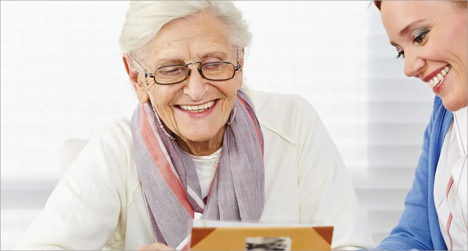 Nurse talking to elderly lady