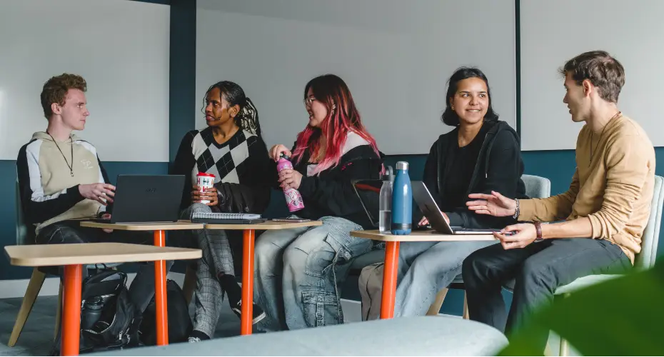 Group of five students in the breakout space next to Babbage computer lab