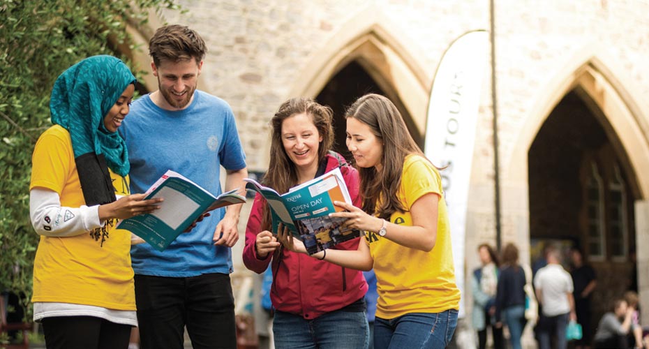 Prospective students exploring University of Exeter campus during open day.