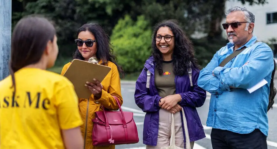 A family talking to a Student Ambassador at a Penryn Campus open day