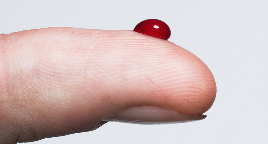 A finger with a droplet of of blood, diabetes, blood test, lab, health