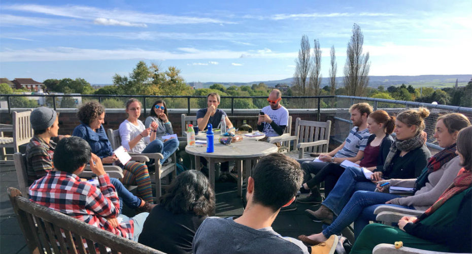 Group of Early Career Researchers sitting on a roof terrace