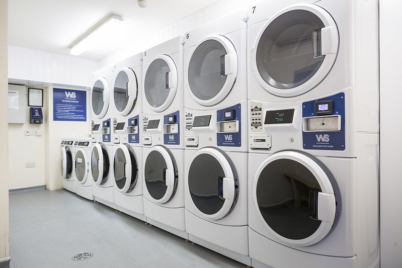 Room filled with washer/dryers