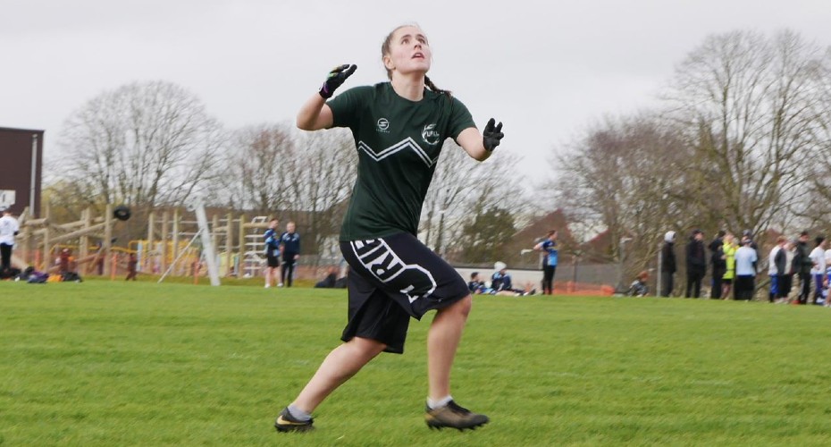 Student playing ultimate frisbee