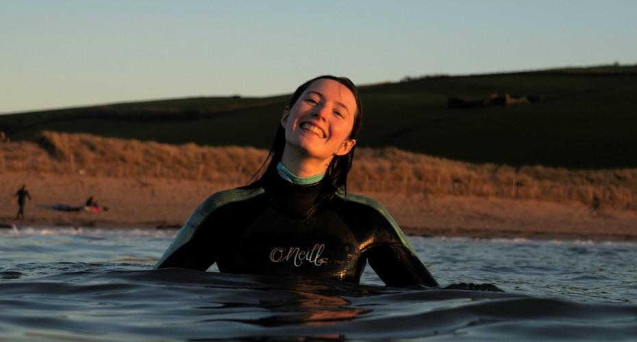 Student wearing wetsuit in water
