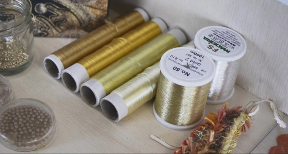 close up of Gold thread reels