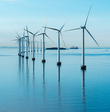 A cluster of wind turbines standing in the water, harnessing the power of wind to generate clean and renewable energy.