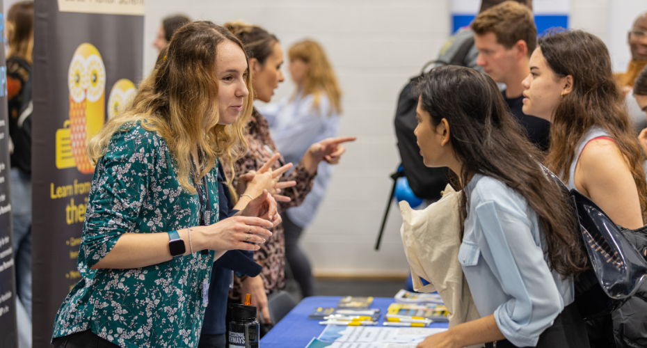 Students engaging with employers at the University of Exeter, Penryn Campus Careers and Opportunities Fair.