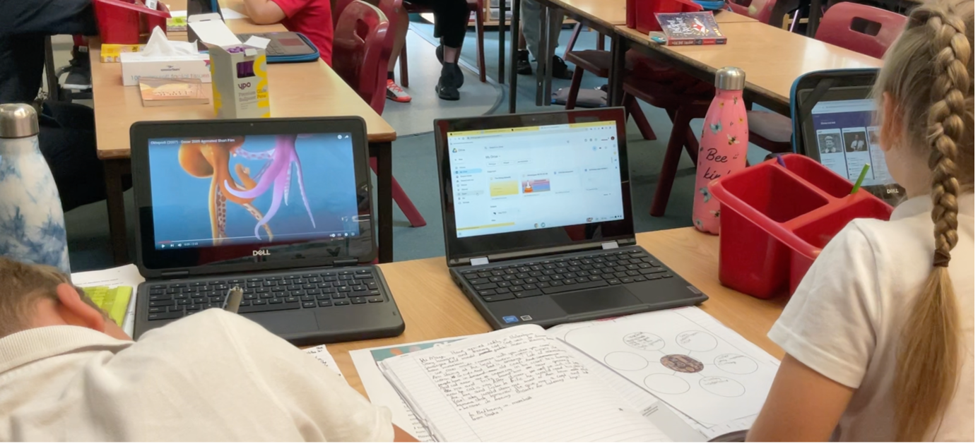 students with digital resources on laptop