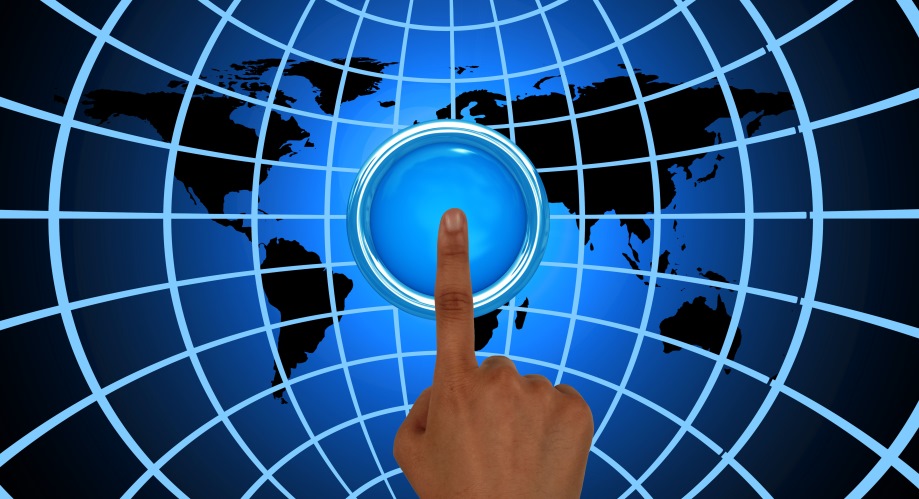 A finger pressing a button against a vibrant blue background, symbolizing interaction and engagement.