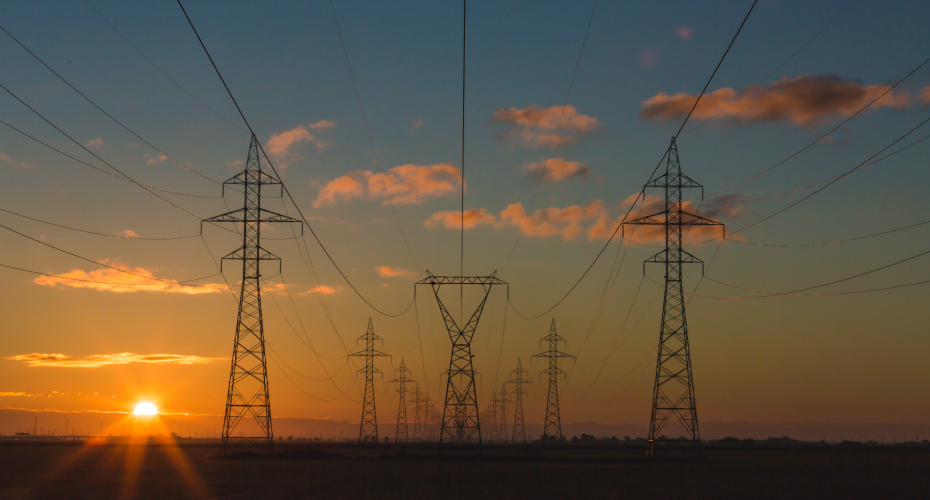 Image of pylons on an orange sunset landscape