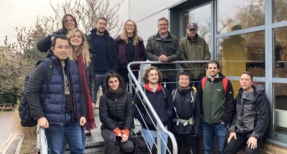 Image of Daniel Partridge and Jim Haywoods research groups, after a Christmas lunch 2021. Taken on a staircase outside.