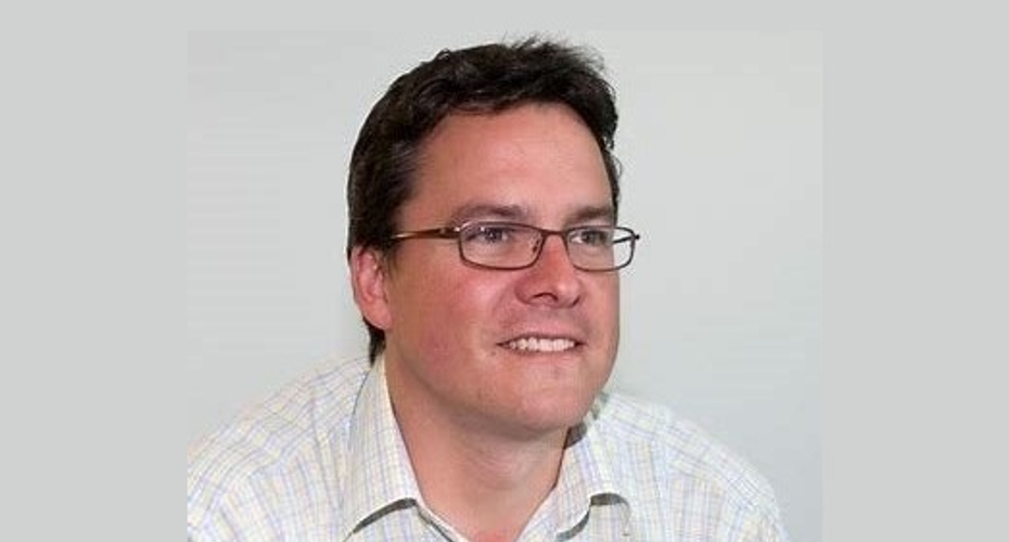 Image of Jim Haywood in a white shirt looking to the right of the camera, on a blank background.