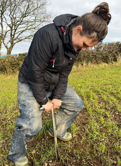 Daisy collecting soil samples