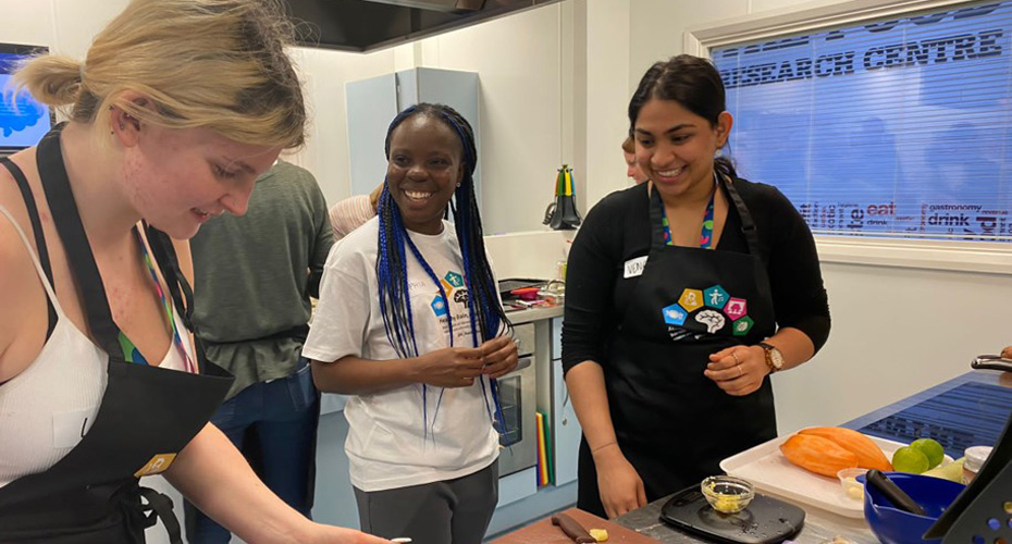 Dr Sophia Amenyah in a kitchen with some participants from the Healthy Brain Healthy Life Project