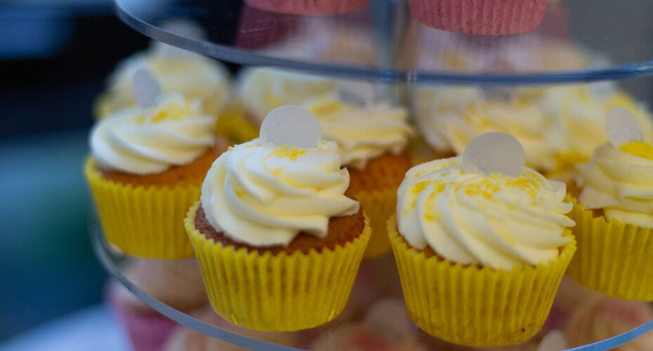 Photo of cup cakes on a cake stand.