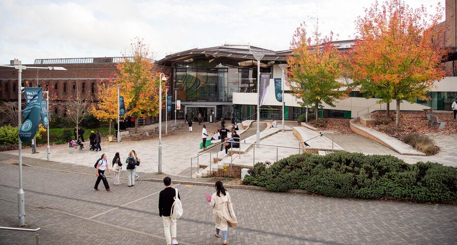 Exterior photograph of the Forum building, with autumn settling-in as the trees begin to shed their leaves.