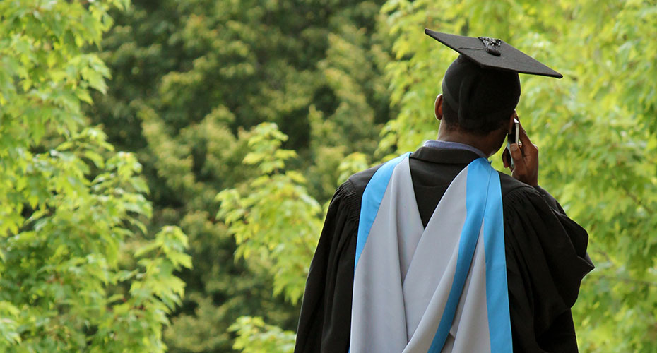 male-student-back-to-camera-graduation930x500