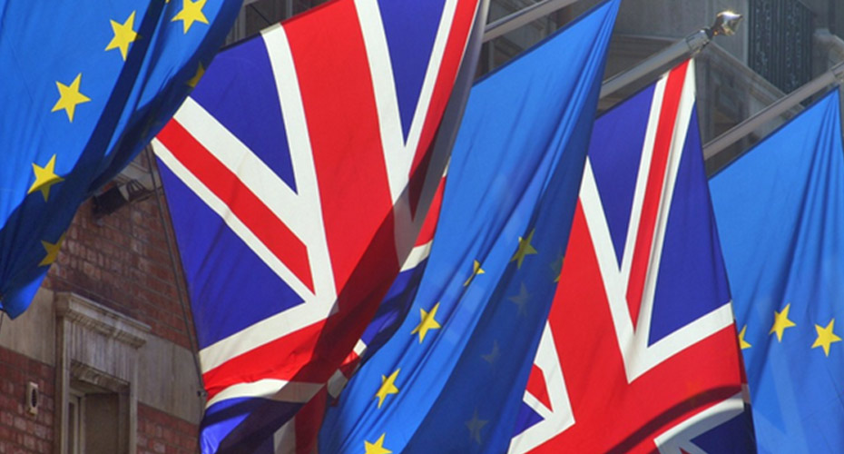 The british and eu flags fluttering in the wind, symbolizing the relationship between the uk and the european union.